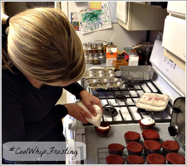 decorating red velvet cupcakes with cool whip frosting