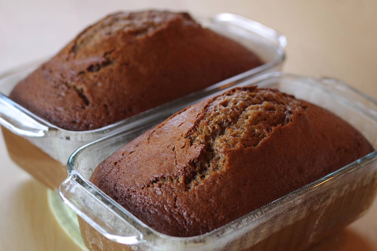 two loaves of sweet bread in glass bread pans