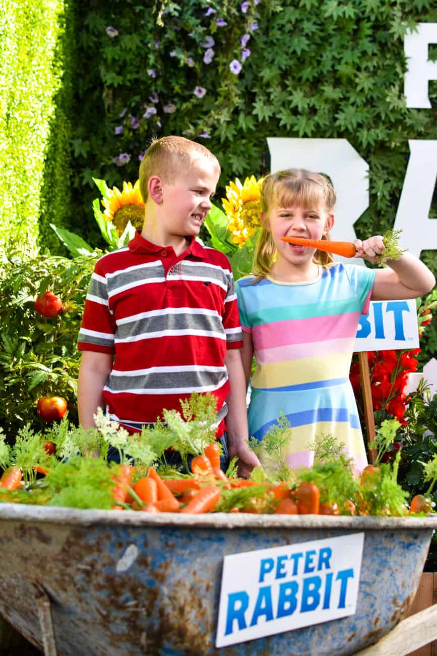Kids with carrot for peter rabbit press junket