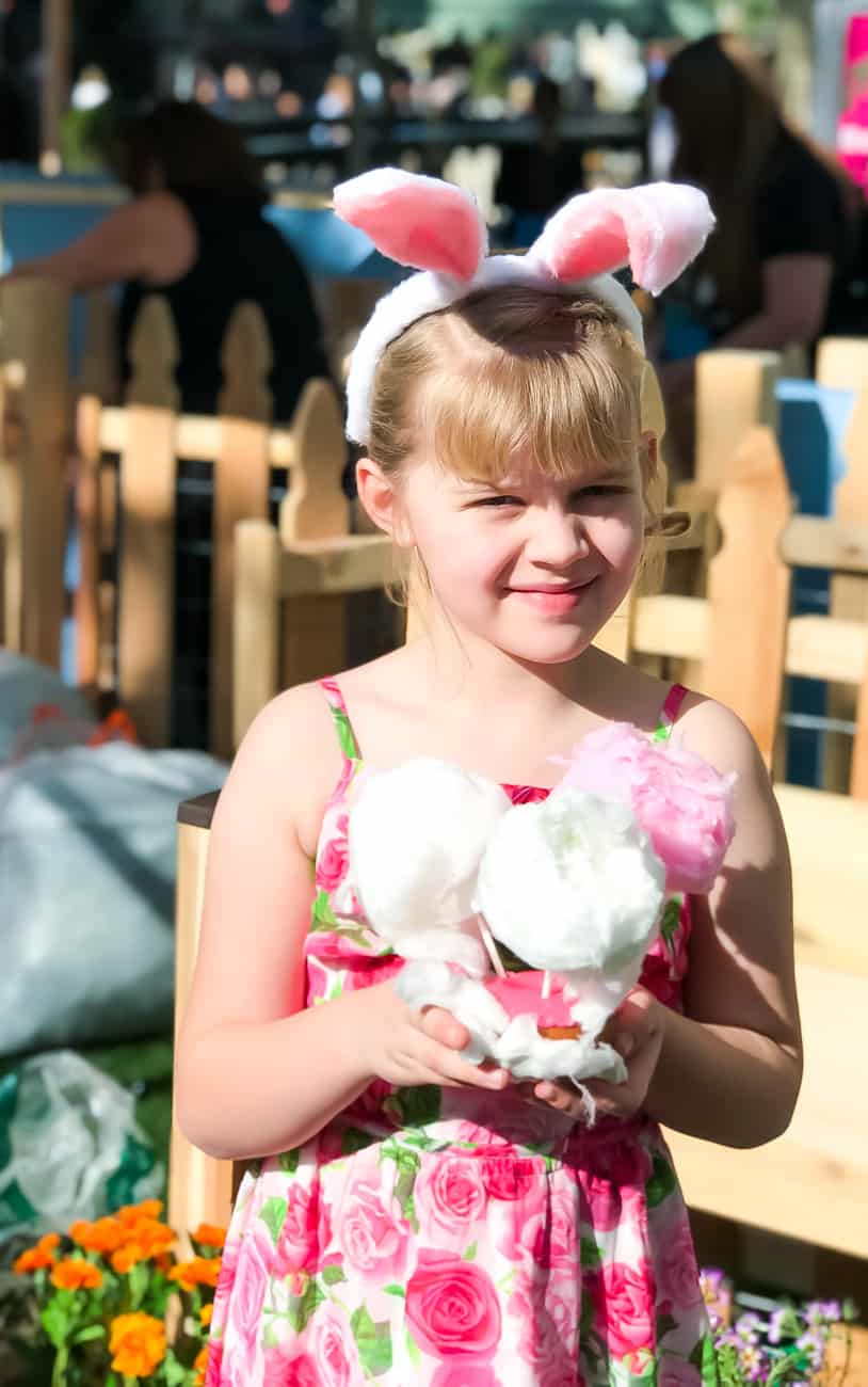 girl holding a cotton candy doughnut at the Peter rabbit premiere