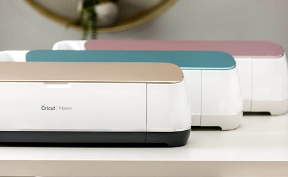 3 Cricut Maker machines in champagne, blue and pink