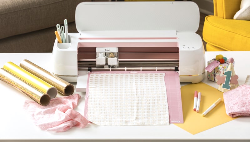 Fabric, vinyl, pens and other materials being used with a Cricut Maker