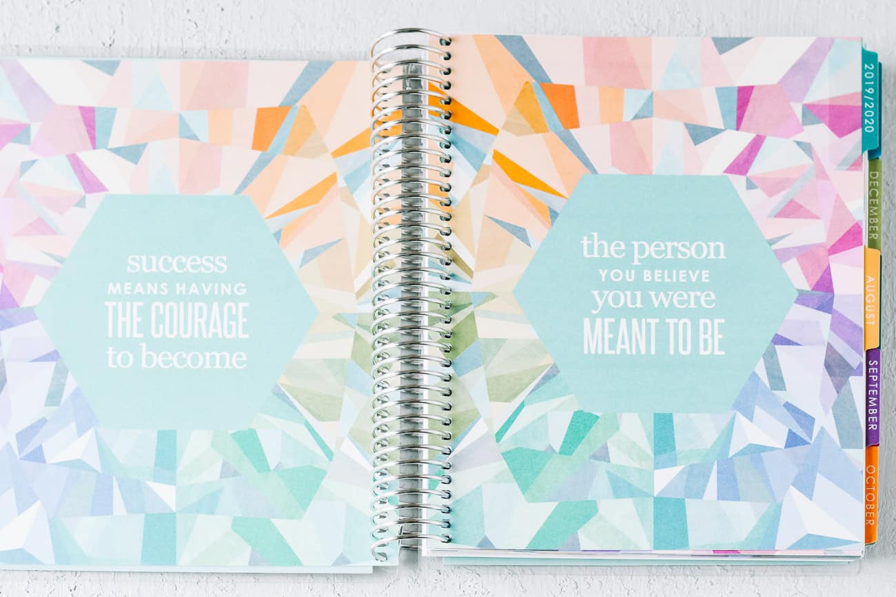 Open spiral bound note book with quotes on two pages