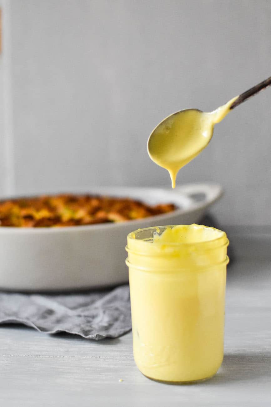 microwave hollandaise sauce recipe with eggs benedict casserole in the background