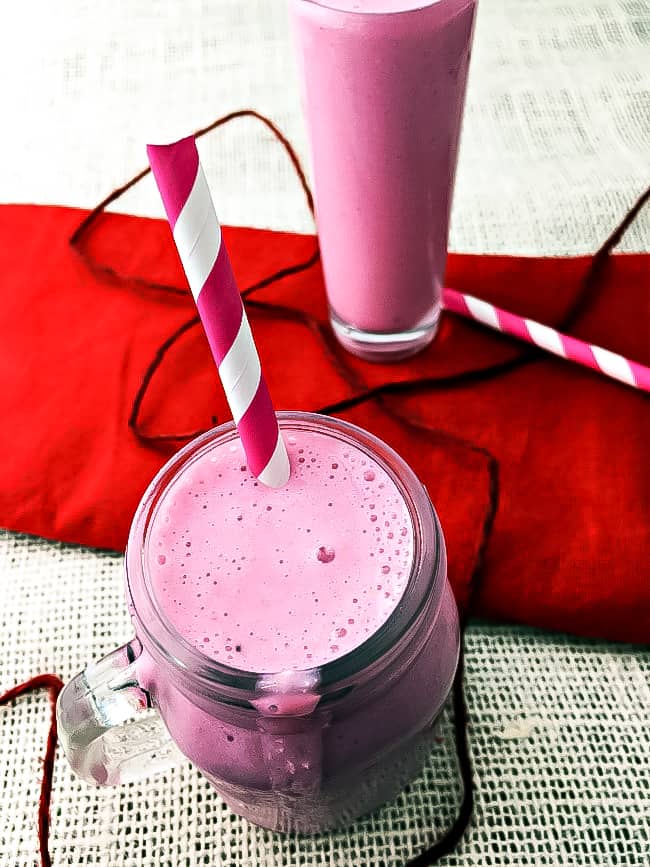 pink smoothie with red and white straw