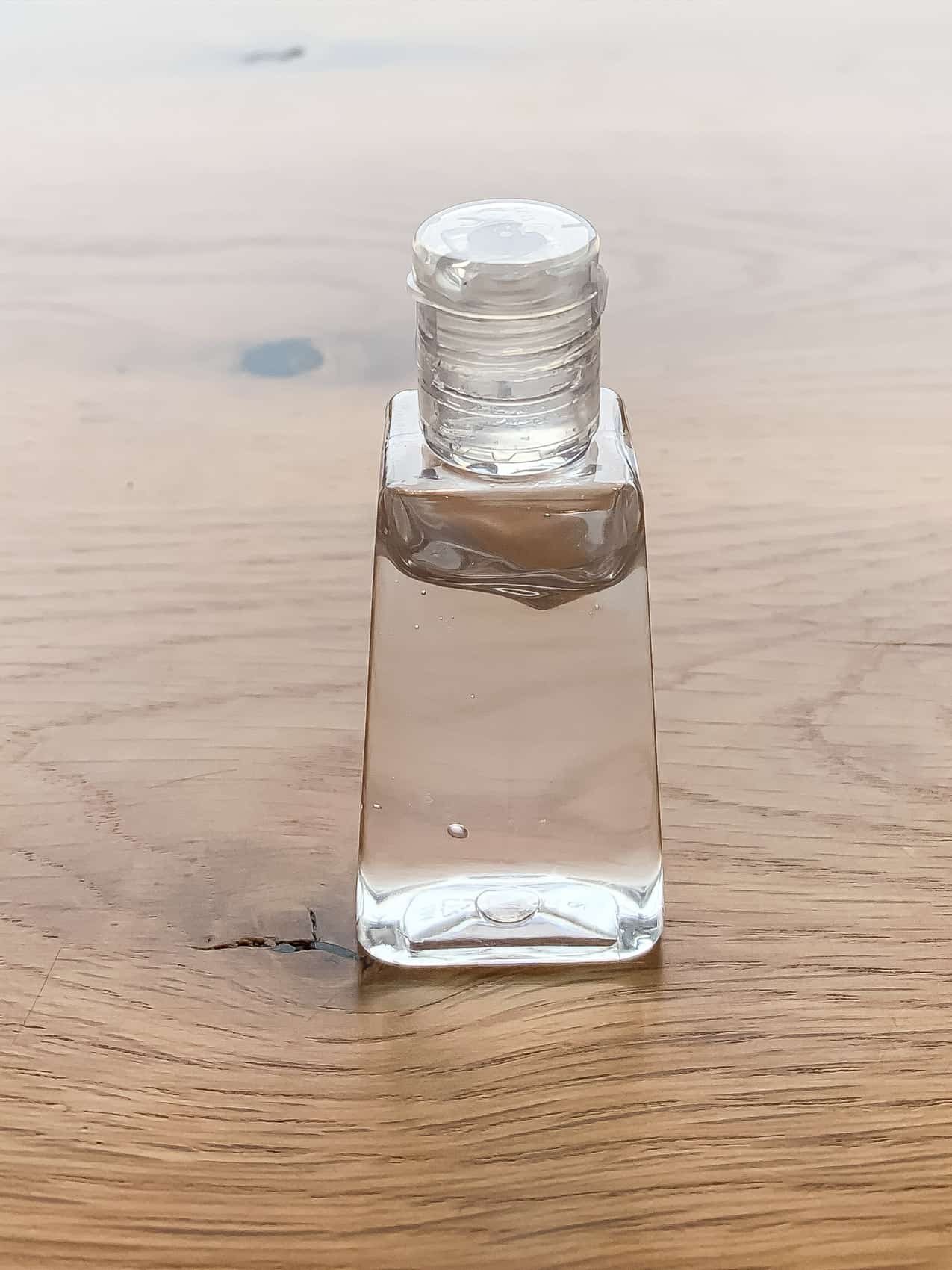 homemade hand sanitizer on wood table
