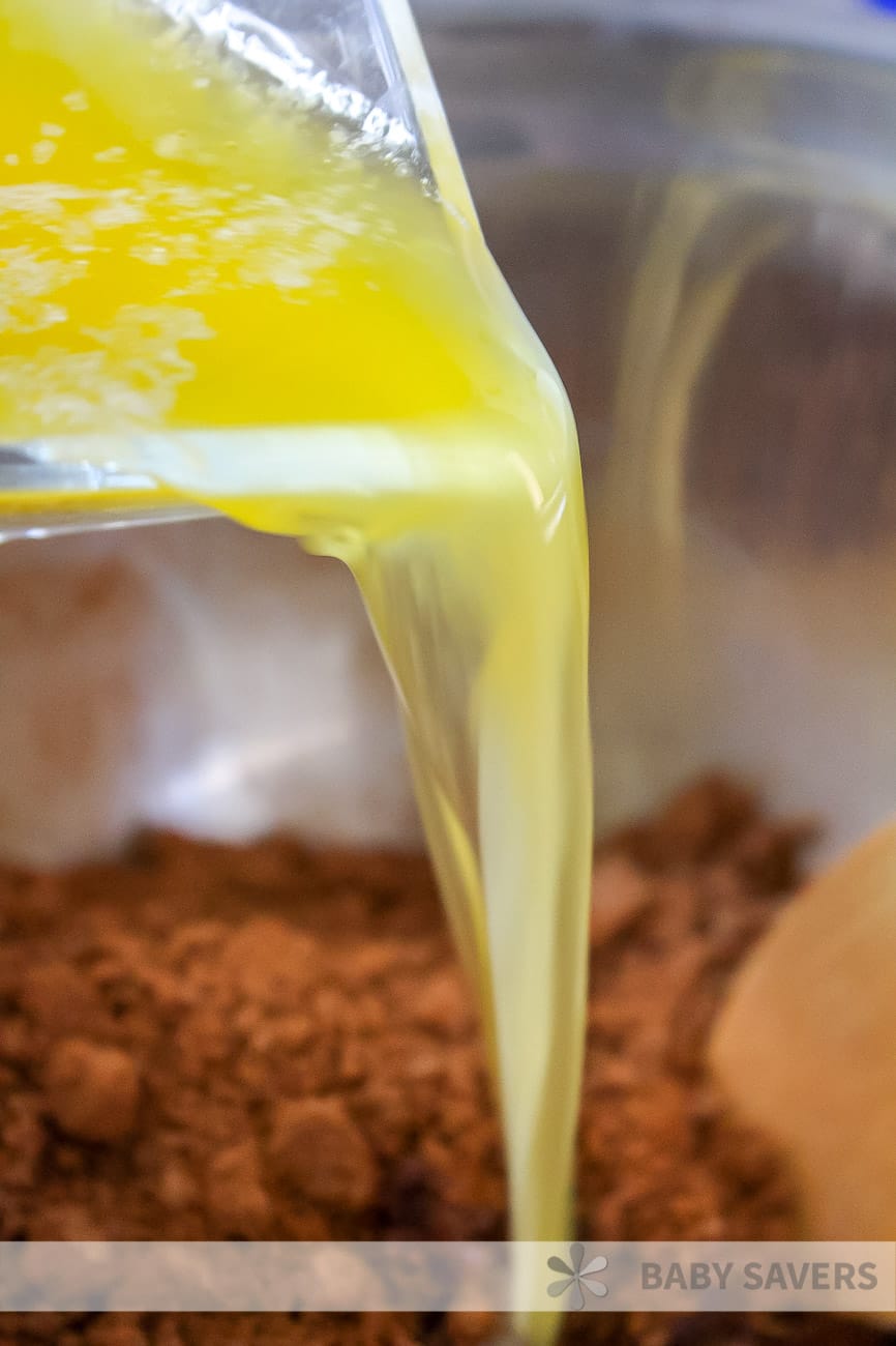 butter pouring into a bowl with cinnamon