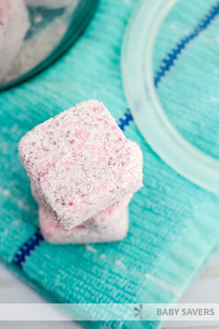 stacked pink squares of homemade laundry soap to use for washing clothes