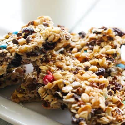 granola bars with multi color candies on a white plate