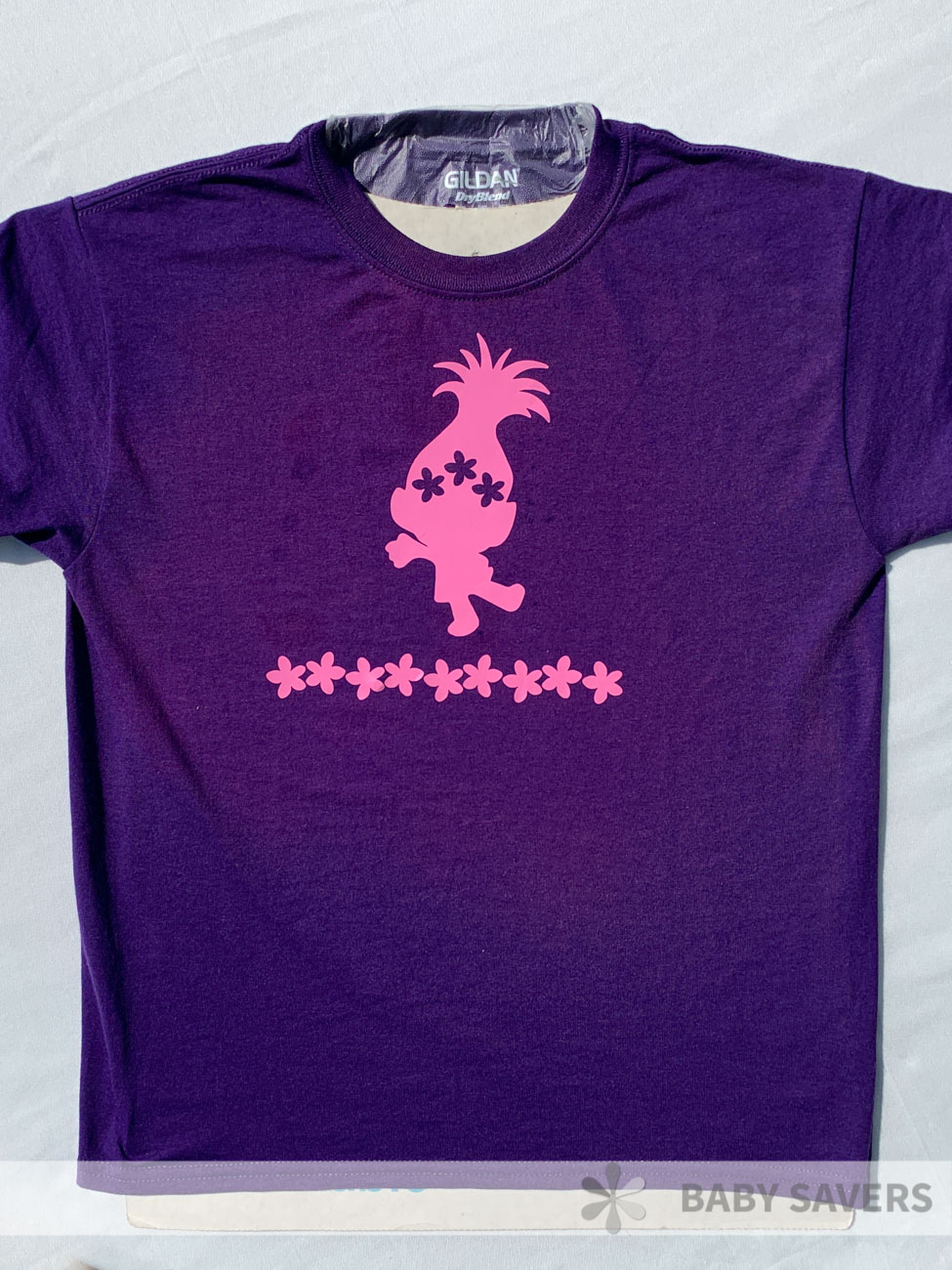 purple shirt with pink trolls sticker on there and reverse dye around the stickers