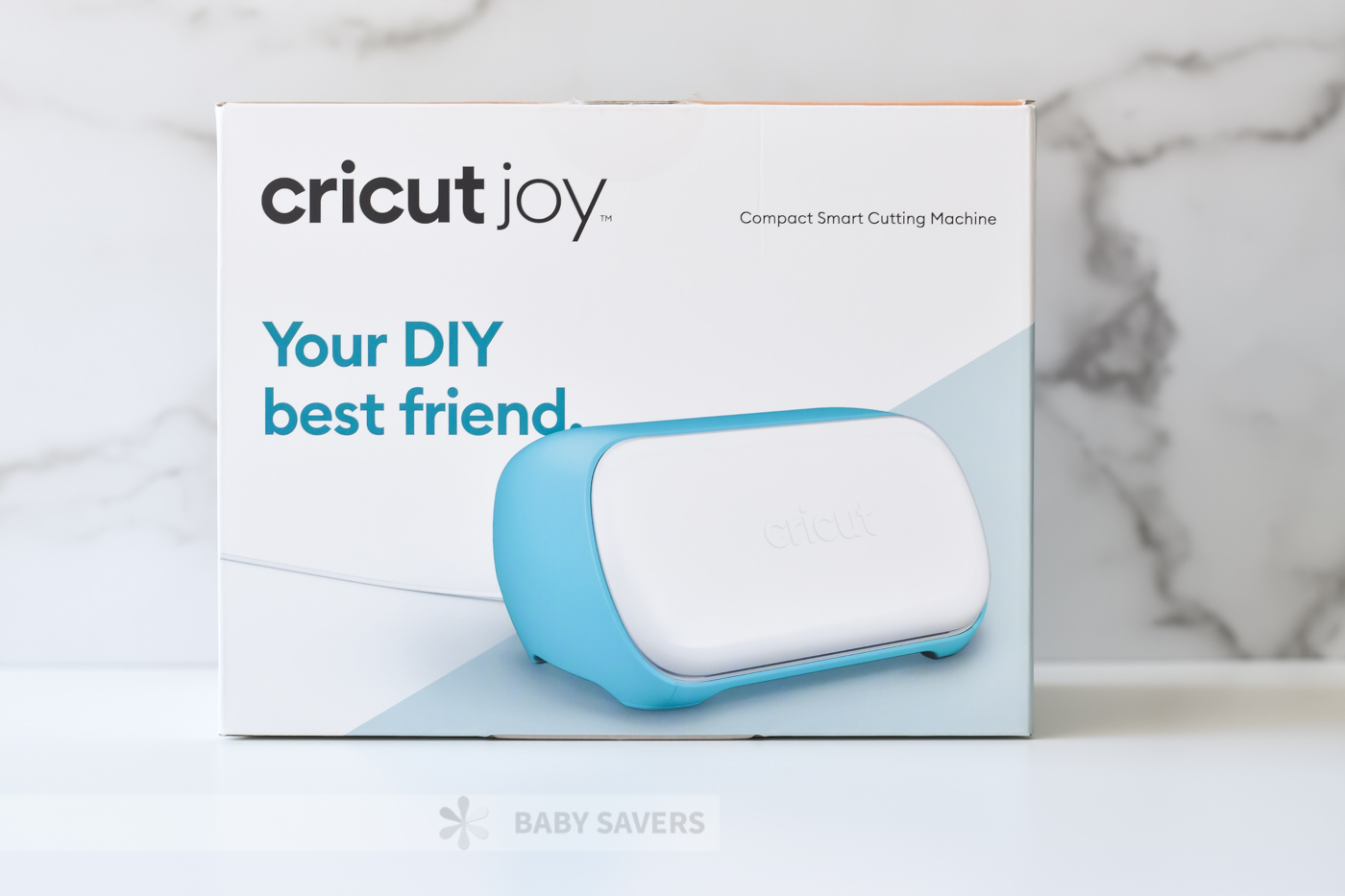 Cricut Joy reviews: cutting machine in box with text:  Your DIY best friend