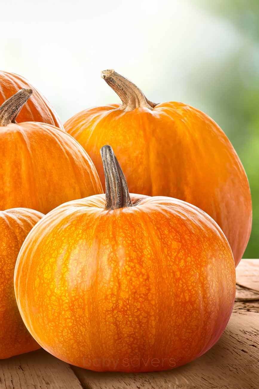 plain pumpkins on a wood table