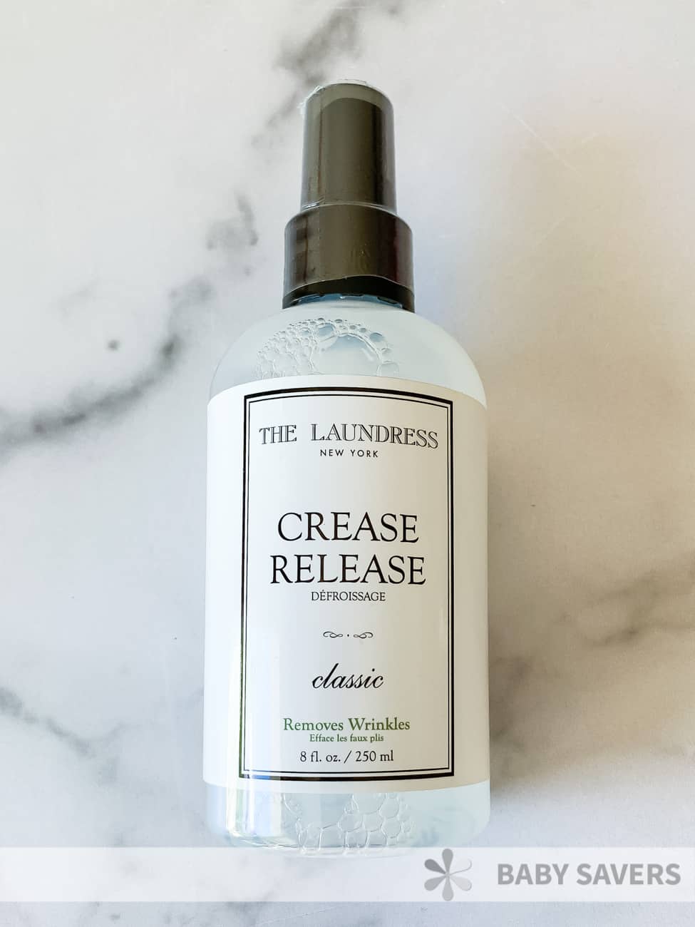 The Laundress Crease Release spray bottle with clear liquid