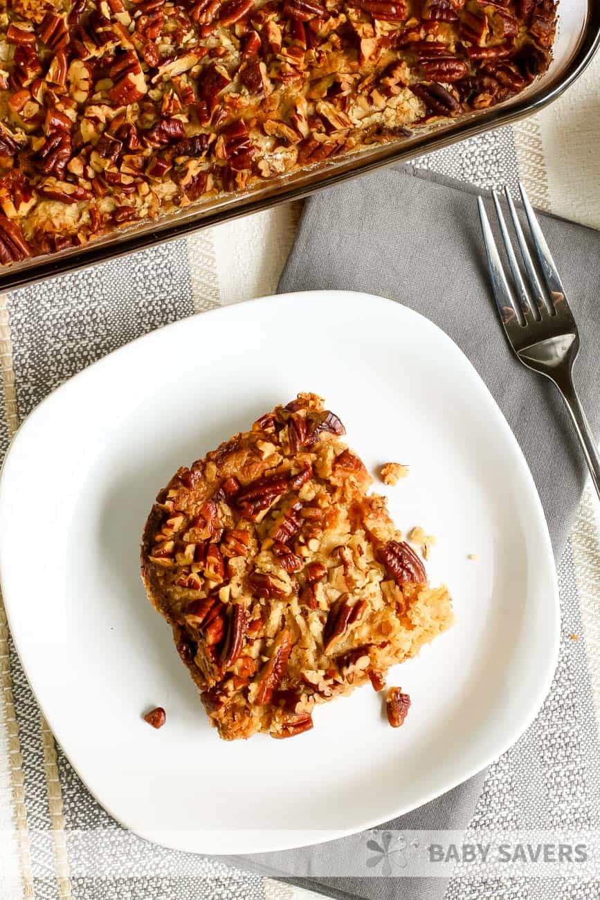 serving of pumpkin crisp on a white plate on a grey placemat