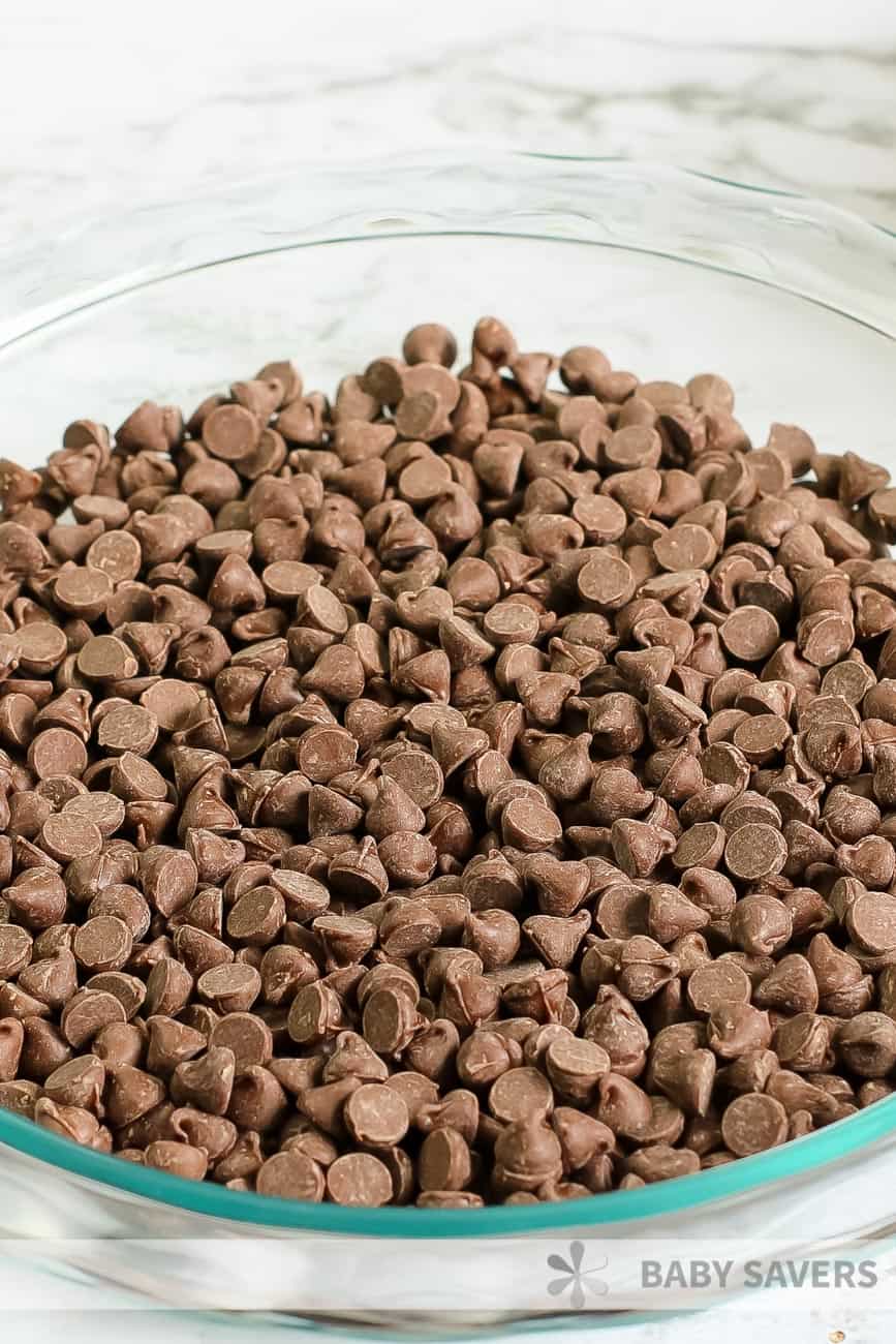 Milk chocolate chips in a clear dish