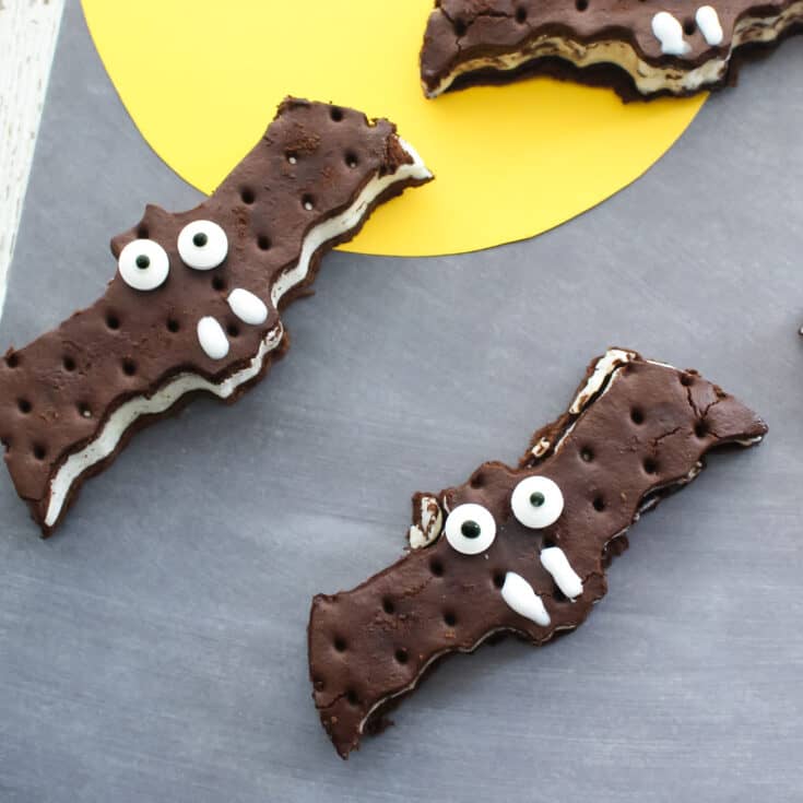 easy halloween dessert. Bat ice cream sandwiches on grey background