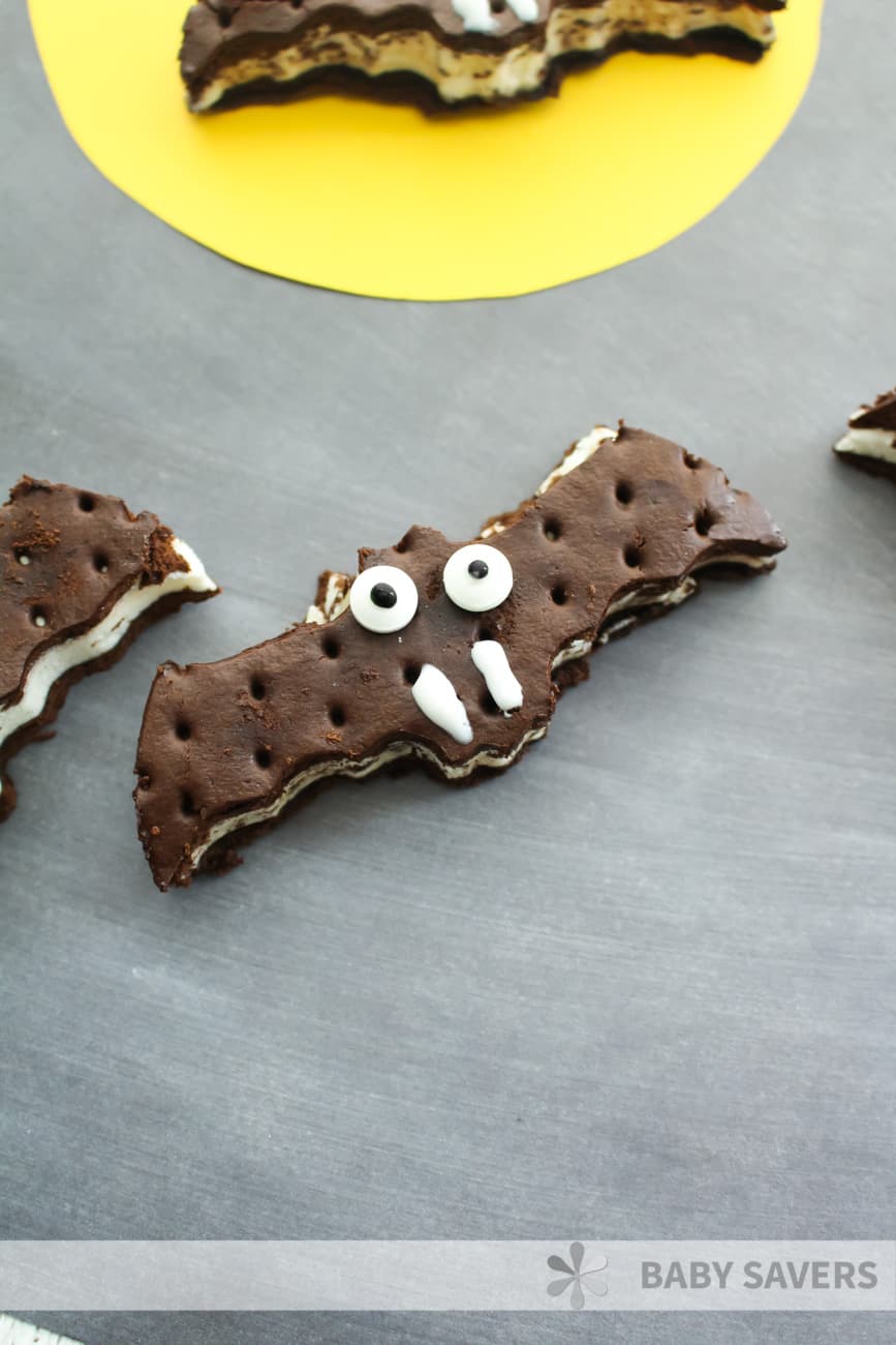 spooky bat shaped ice cream sandwiches decorated with eyes and fangs 