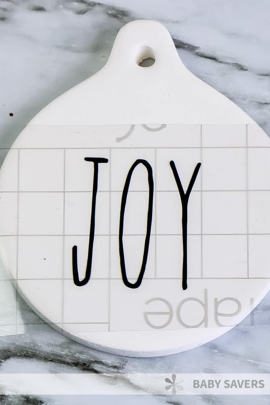 DIY Rae Dunn christmas ornament with joy on transfer tape