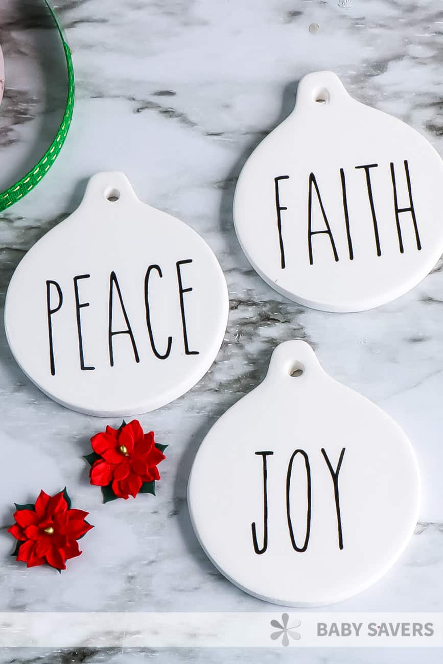 Rae Dunn Inspired Christmas ornaments with Peace, Faith, Joy in vinyl on them