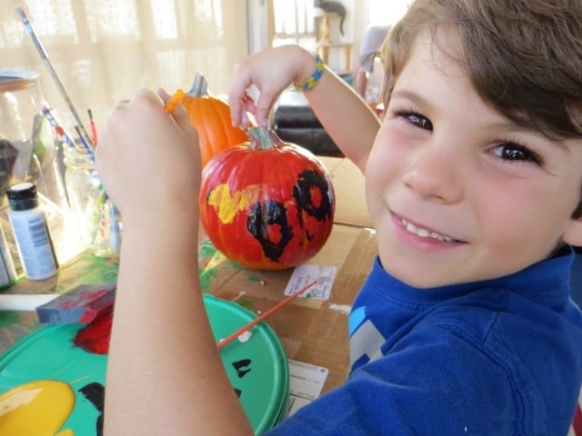 painting a pumpkin for Halloween