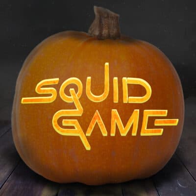 squid game pumpkin carving stencil pictured on a pumpkin with the logo for the series