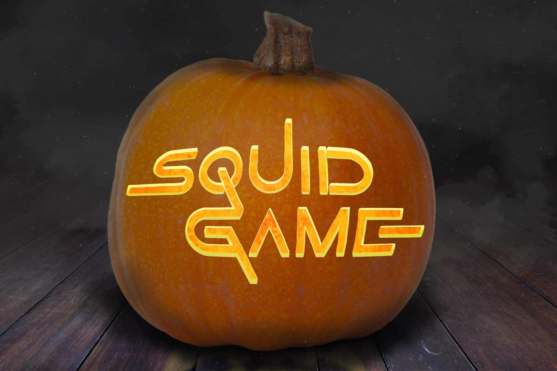 Squid Game pumpkin carving stencil with the logo on a Halloween jack o lantern