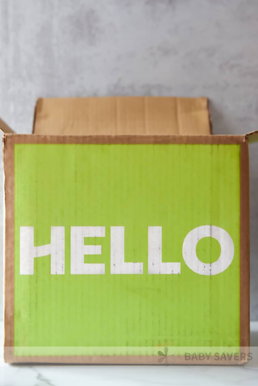 Hello Fresh Reviews - green delivery box with the text HELLO on it in white