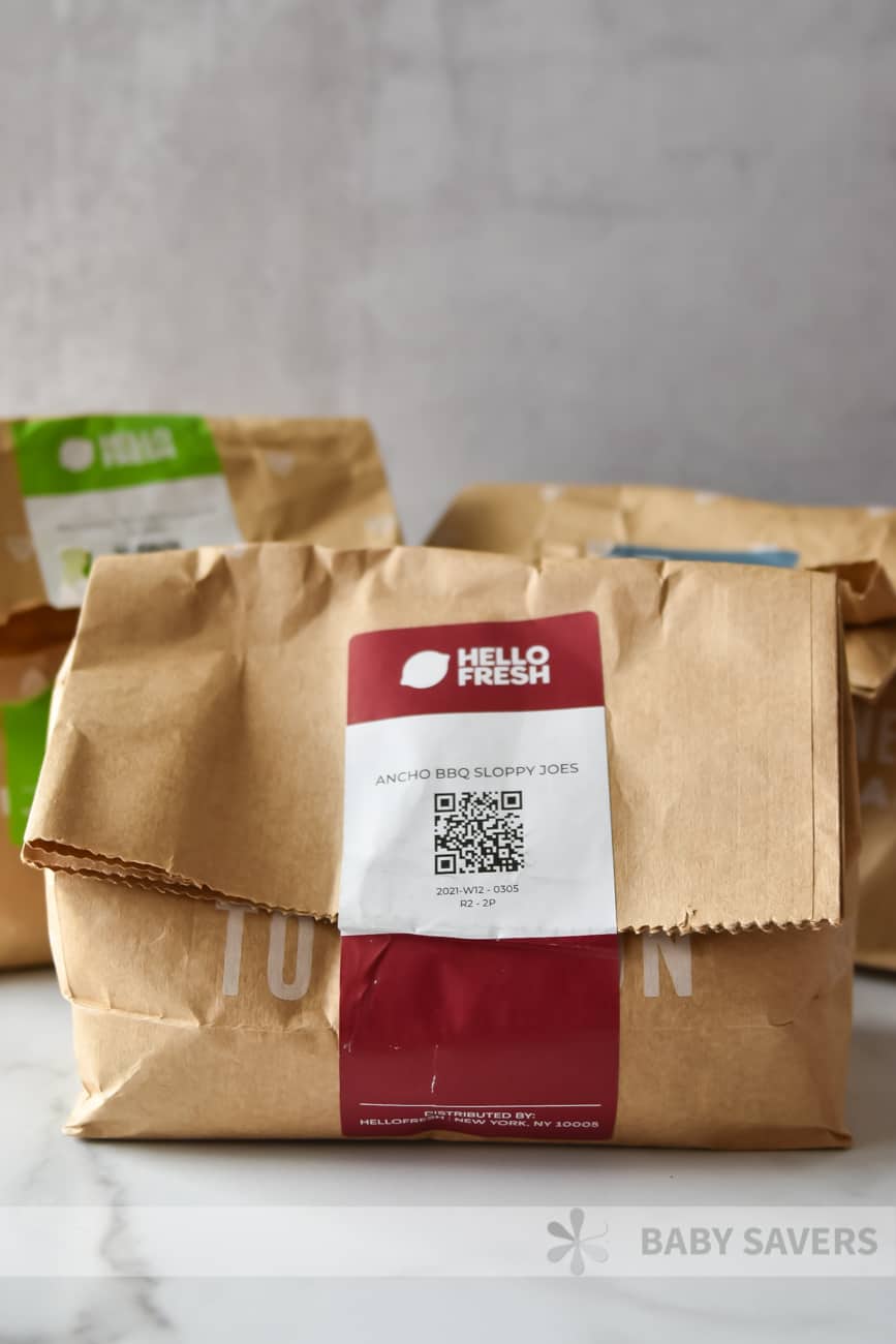 Hello Fresh reviews - sealed paper bag with sticker label stating Ancho BBQ Sloppy Joes
