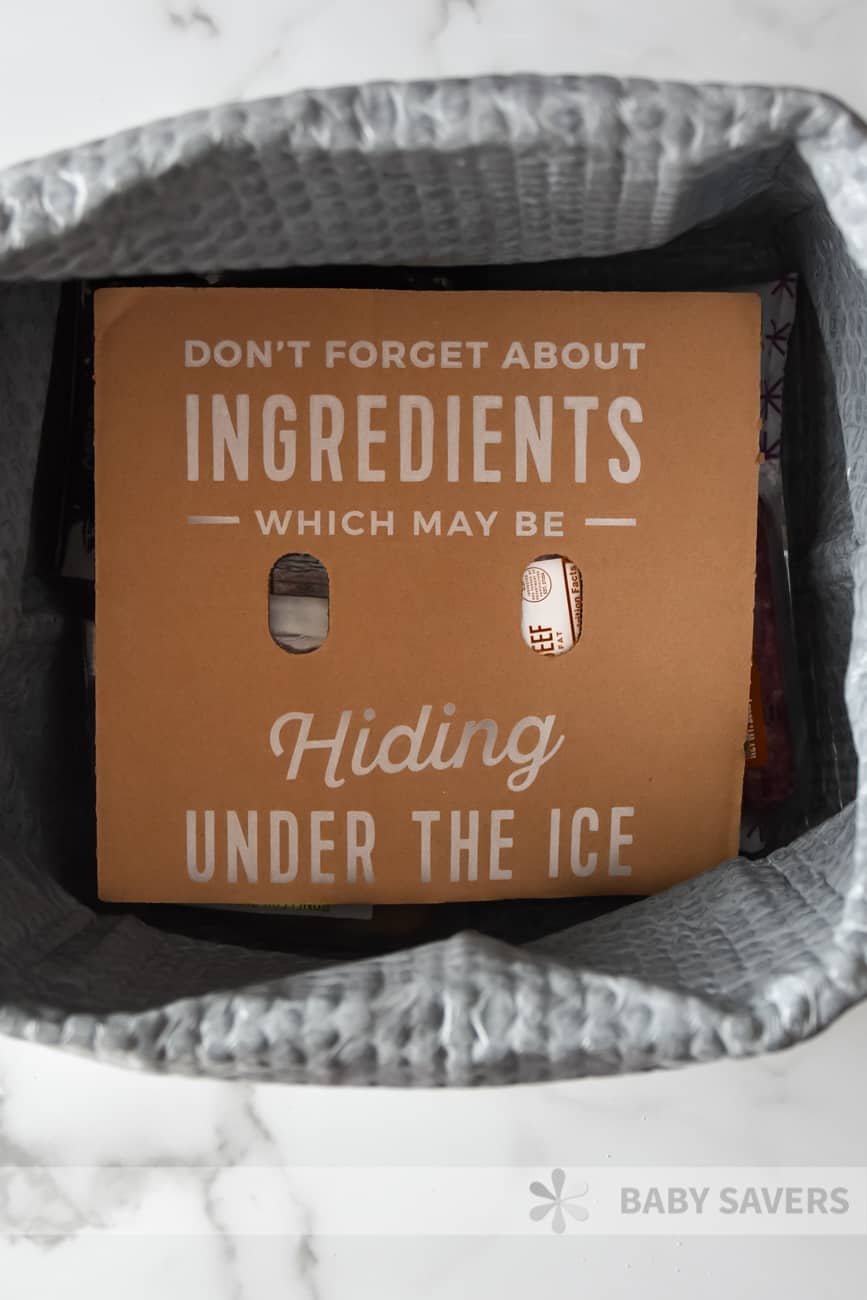 Hello Fresh reviews - inside of meal kit delivery box with a cardboard divider stating: don't forget about ingredients which may hiding under the ice.