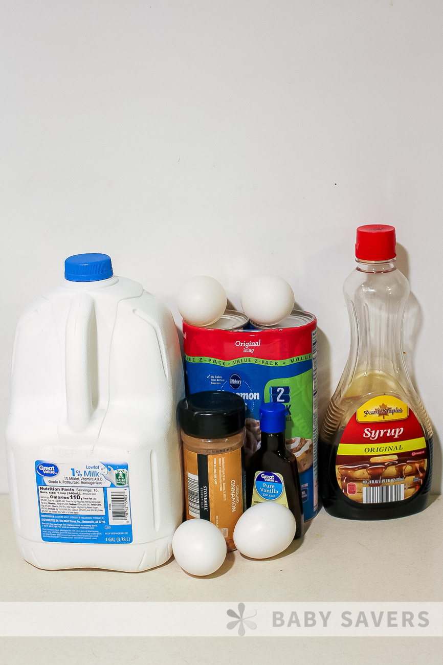 ingredients for crock pot cinnamon roll casserole with milk, eggs, cinnamon, refrigerated cinnamon rolls, maple syrup and vanilla extract