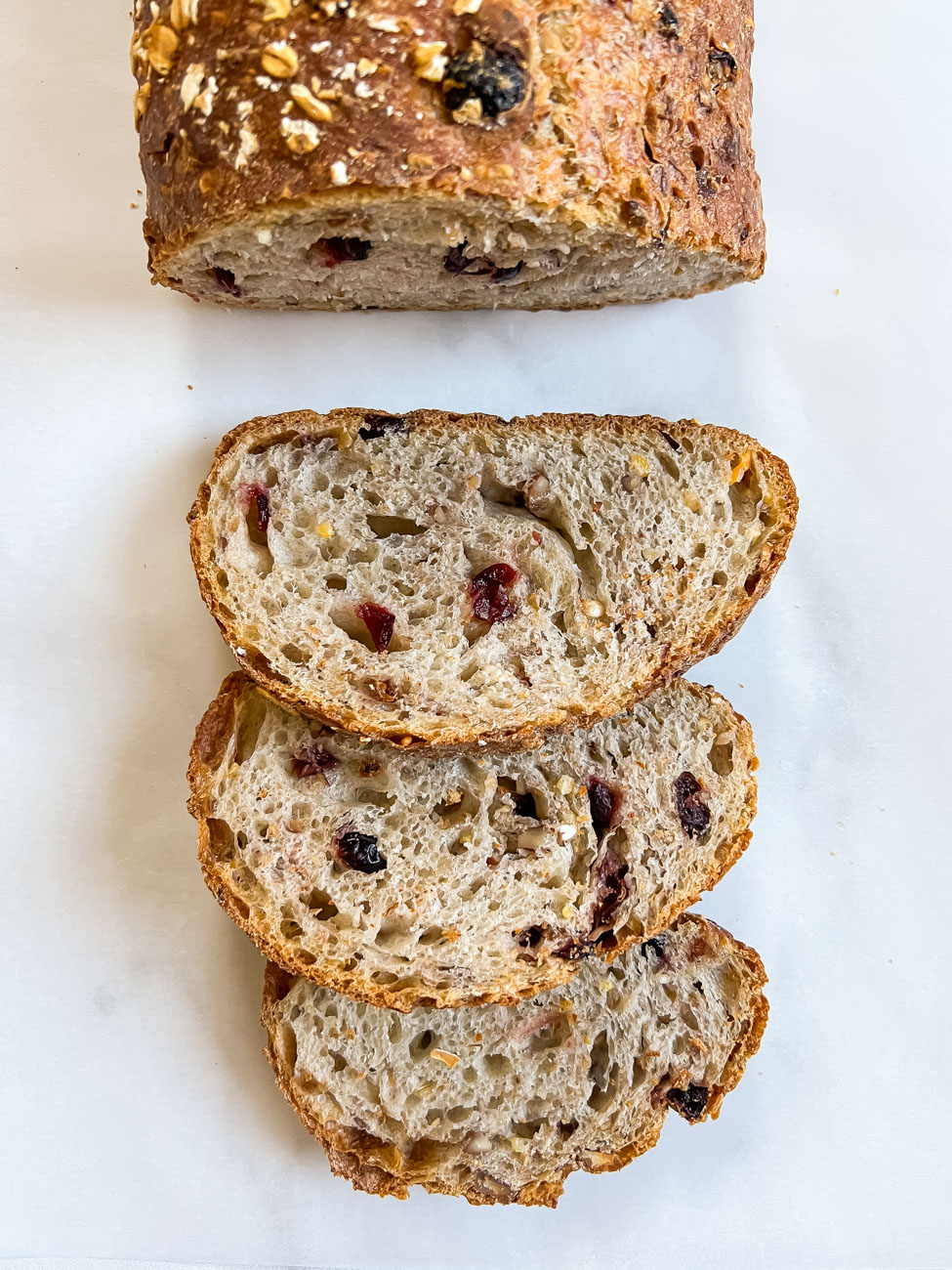 wildgrain reviews : cranberry pecan loaf of bread and slices of bread.