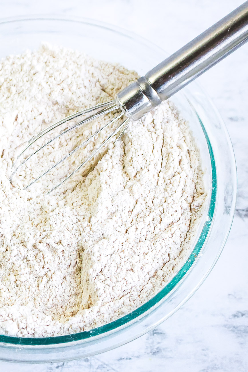 pumpkin scone recipe dry ingredients with silver whisk