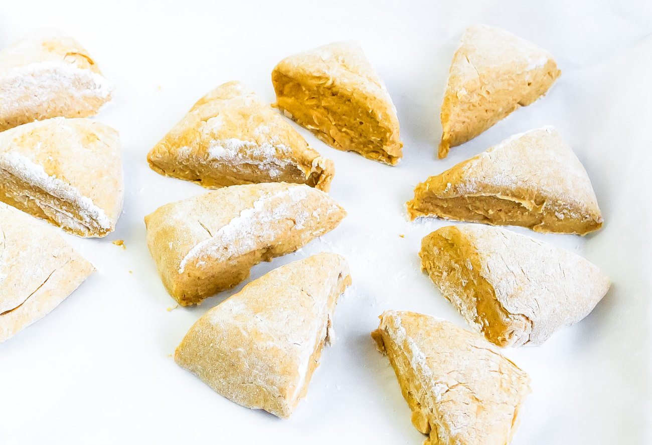 wedges of pumpkin scone dough in a circle