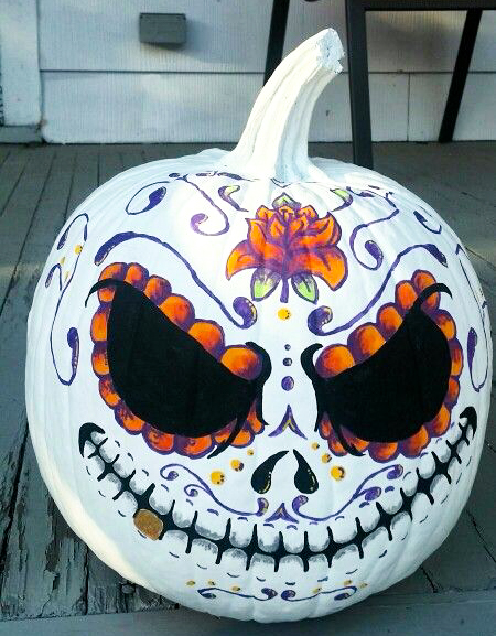 painted jack skellington pumpkin in a sugar skull style