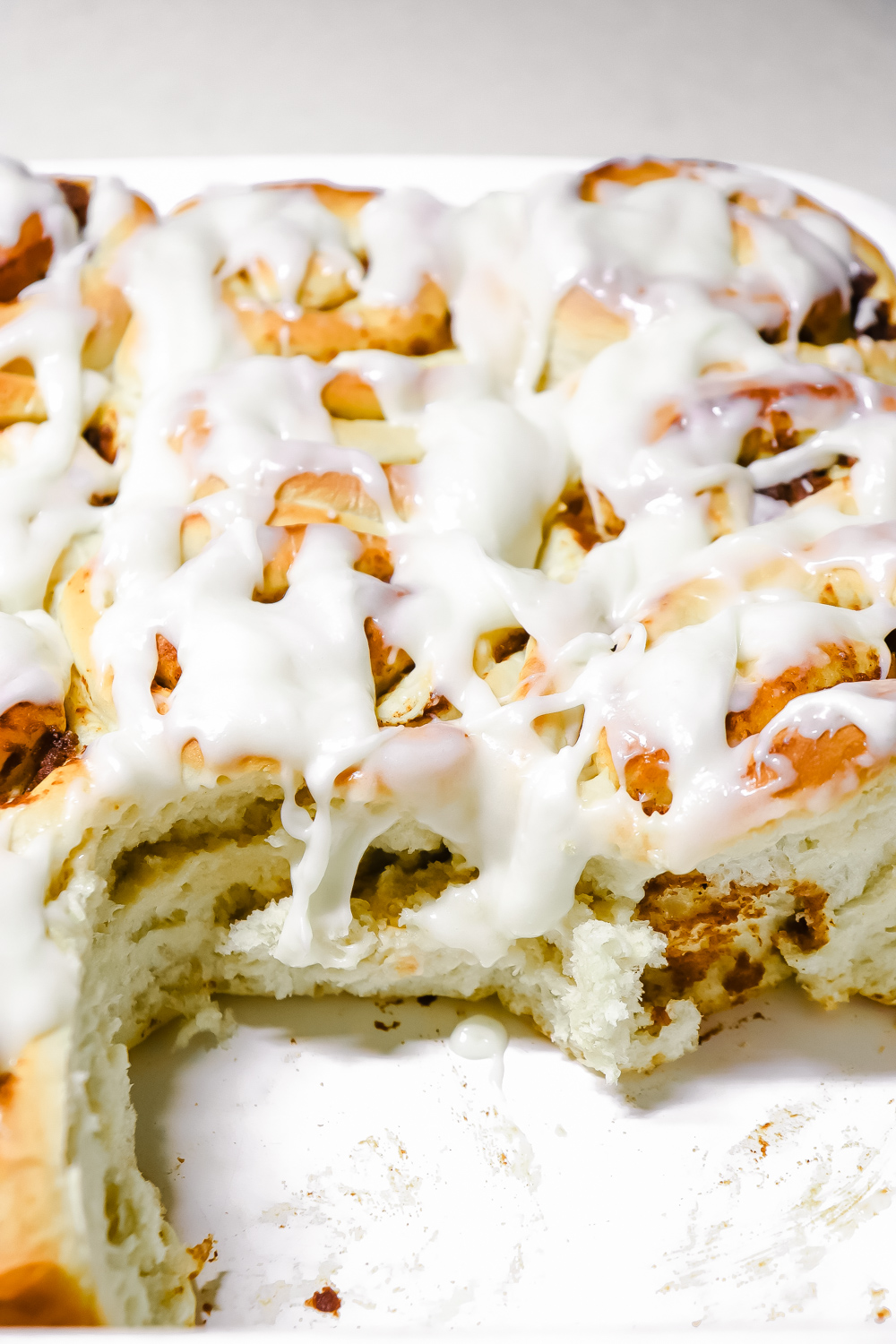 pumpkin cinnamon rolls recipe in baking dish