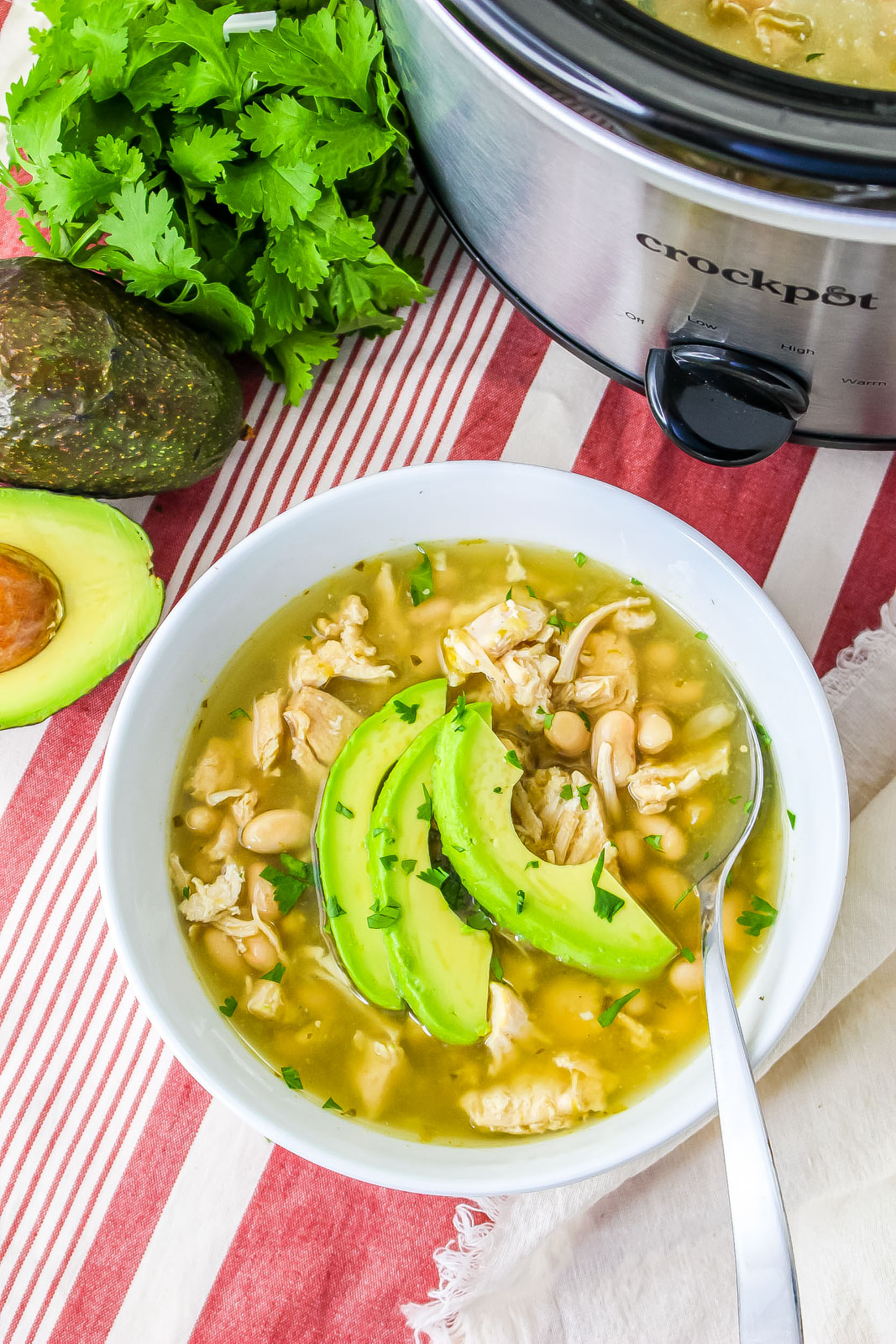 white bean chicken chili in a bowl with a spoon