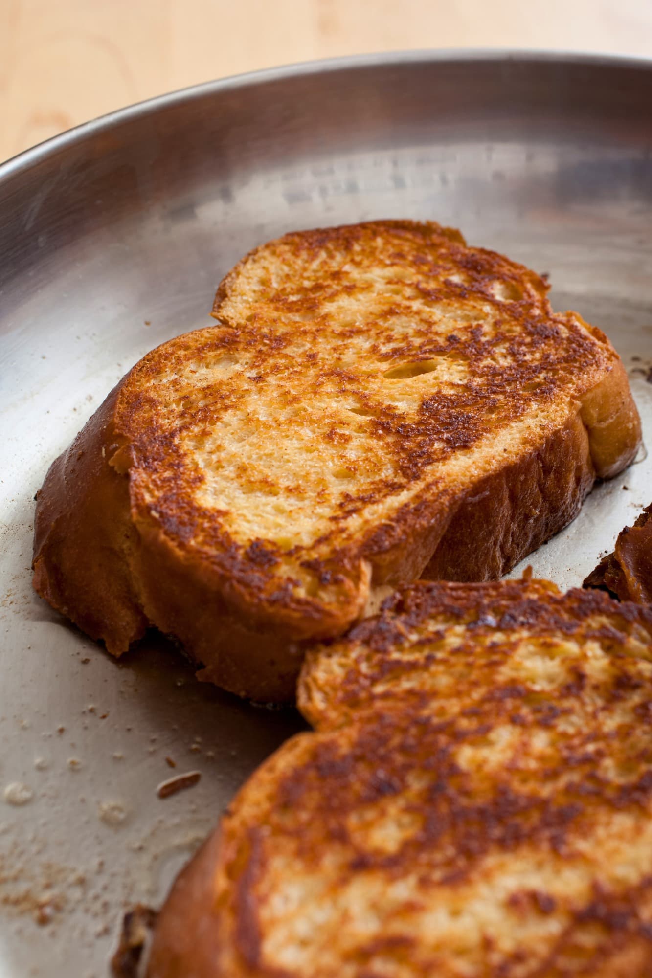 2 slices of french toast in a frying pan