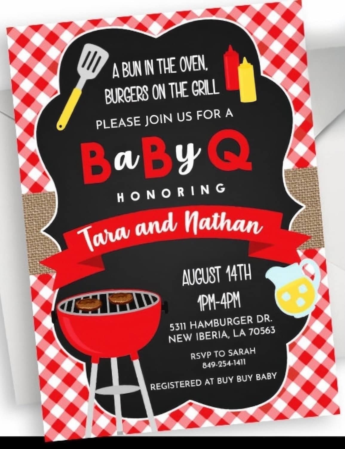 Baby-Q invitation with a red and white checkered border. Text reads: "A bun in the oven, burgers on the grill. Please join us for a barbecue baby shower honoring Tara and Nathan. August 14th, 1PM-4PM. 5311 Hamburger Dr., New Iberia, LA. RSVP to Sarah.