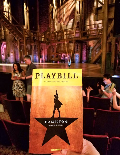 Hamilton playbill and stage for blogger bash